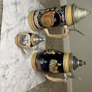 German-style beer steins, traditional ornamental beer mugs made of stoneware